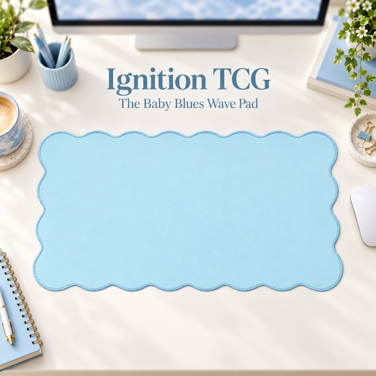 The Baby Blues Wave Pad scalloped desk mat — styled desk hero; accessories are props