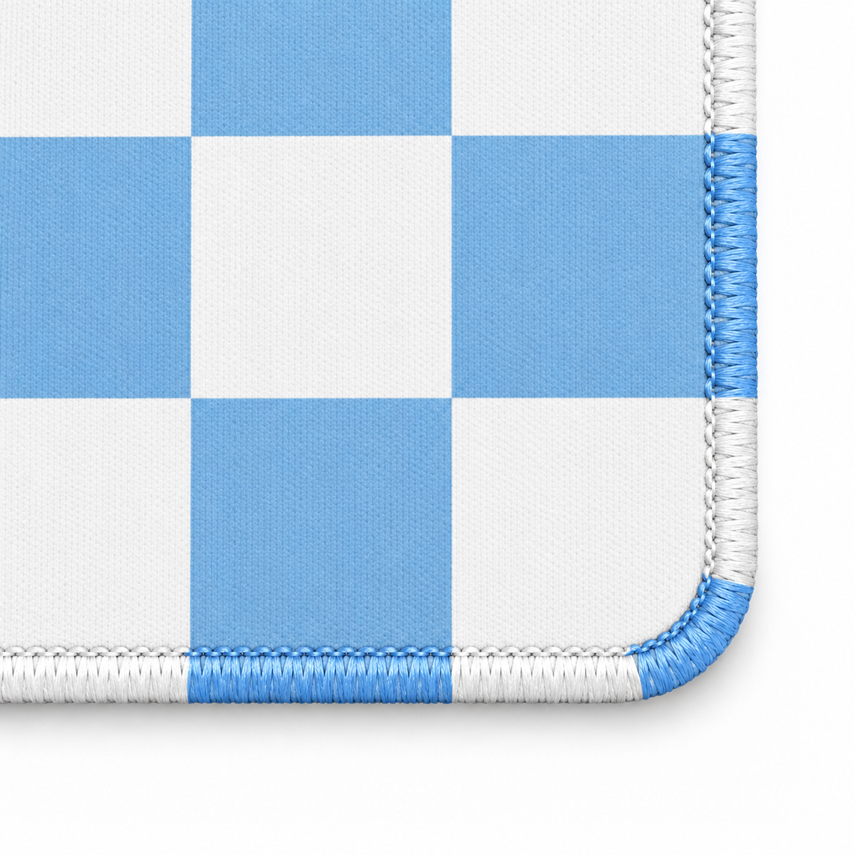 Checker blue mahjong mat corner with alternating white and artwork-colored stitches