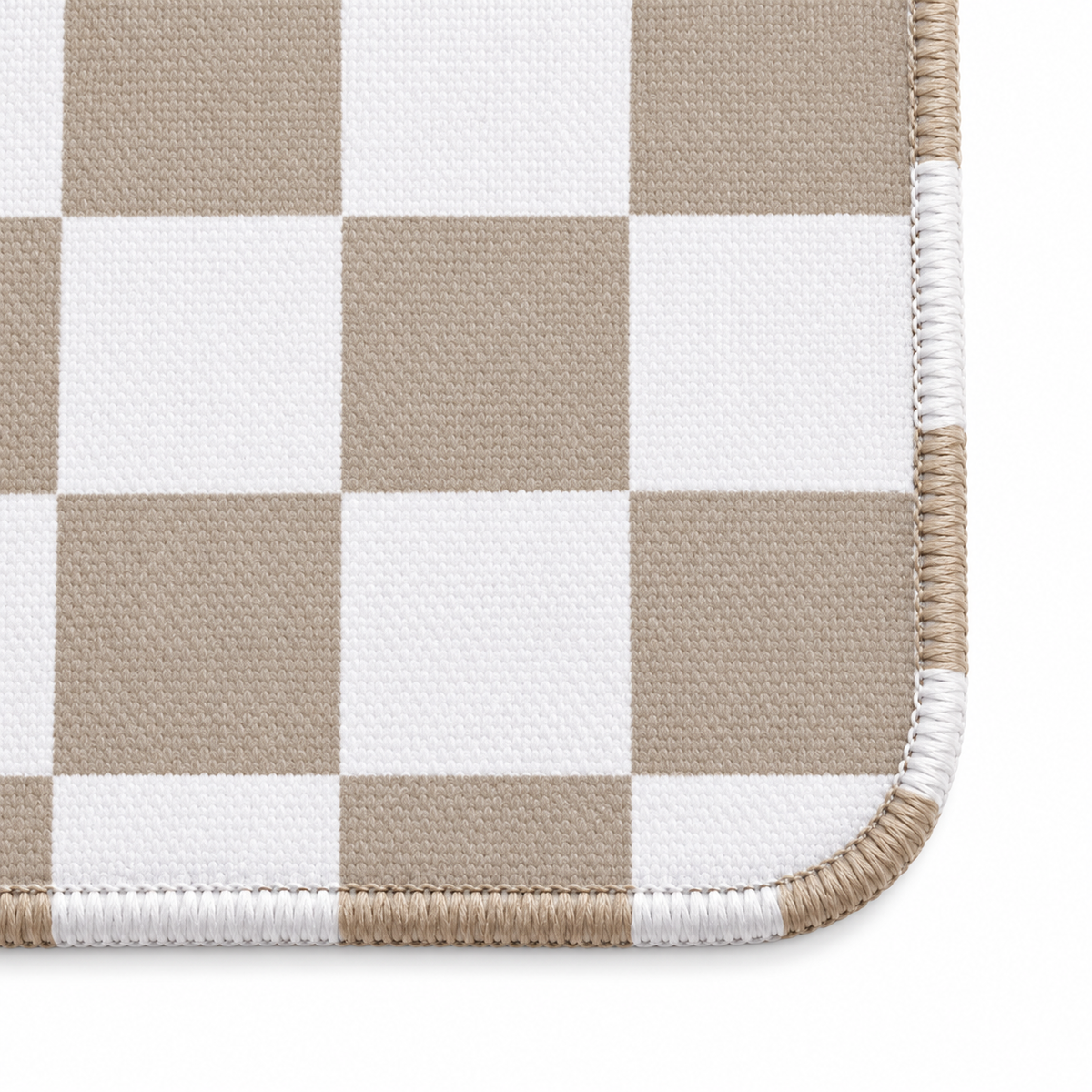 Checker mocha mahjong mat corner close-up with stitching that follows each colored and white square