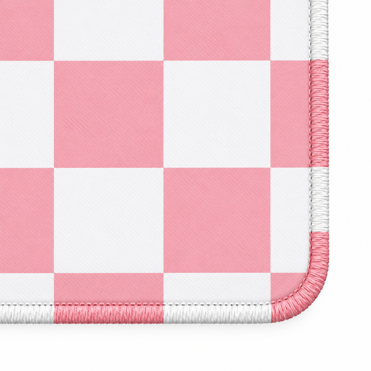 Checker pink mahjong mat corner with alternating white and artwork-colored stitches