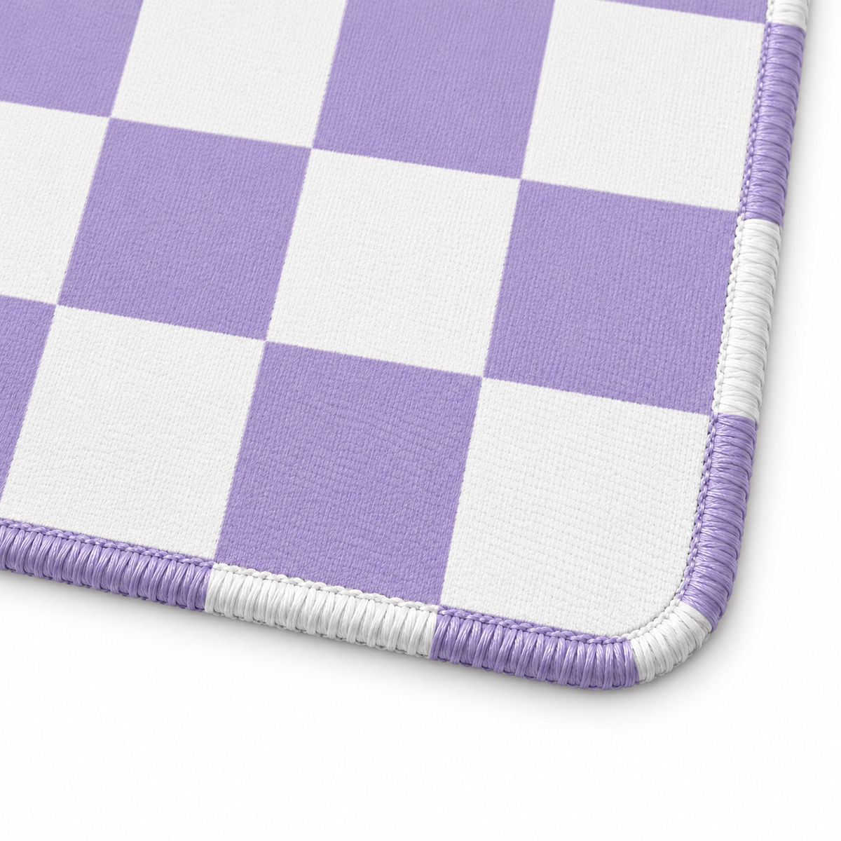 Checker purple mahjong mat corner close-up with stitching that follows each colored and white square