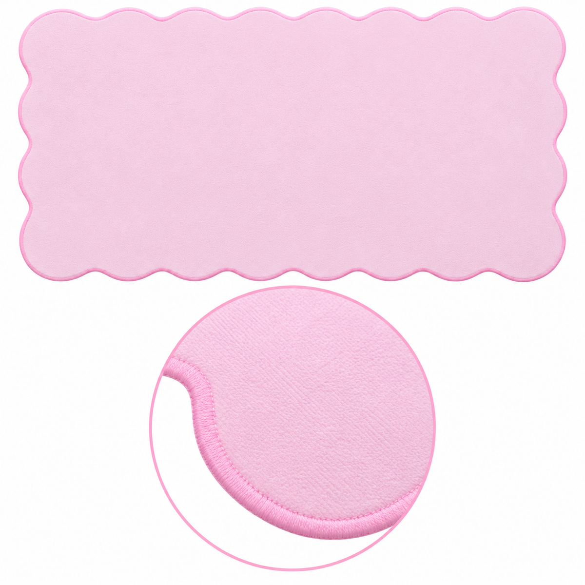 The Cotton Pink Wave Pad scalloped desk mat — matching stitched-edge close-up
