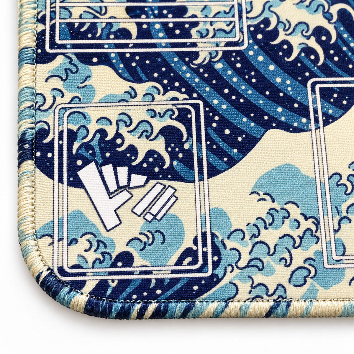 Great Wave One Piece playmat close-up with ivory and blue artwork-colored stitched edges