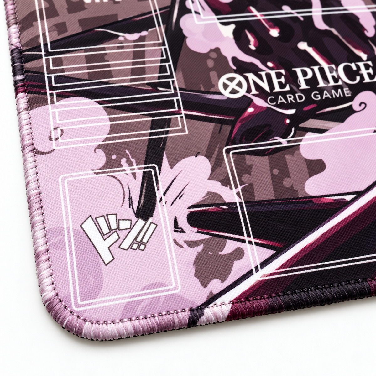 Luffy One Piece playmat corner detail with artwork-colored stitches