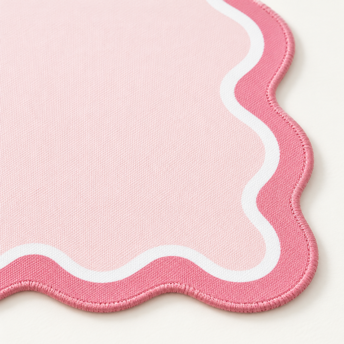 Rose pink artwork-matching stitching on Pink Ribbon Scallop mahjong mat