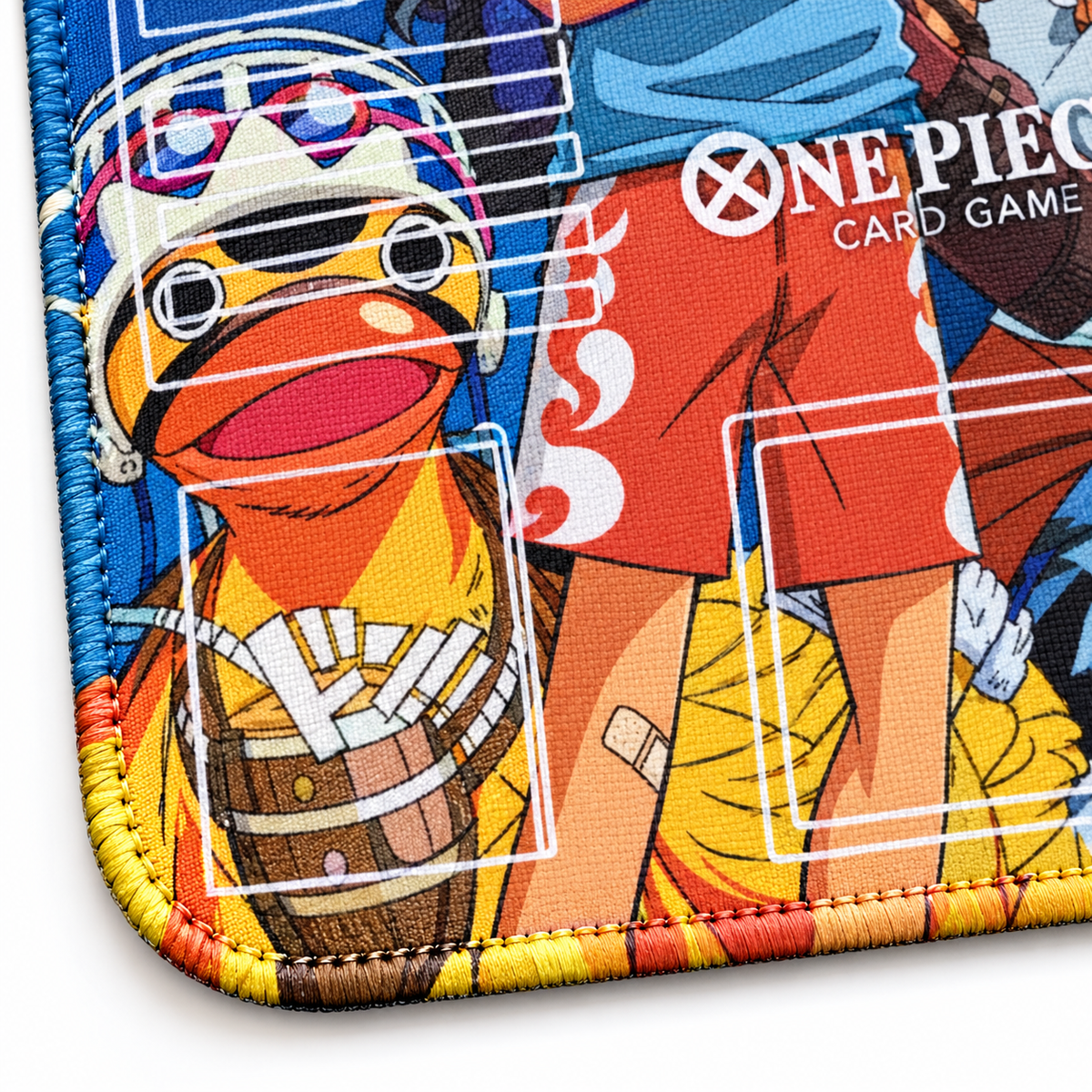 Straw Hat Pirates One Piece playmat corner close-up with blue, yellow and orange artwork-colored stitching