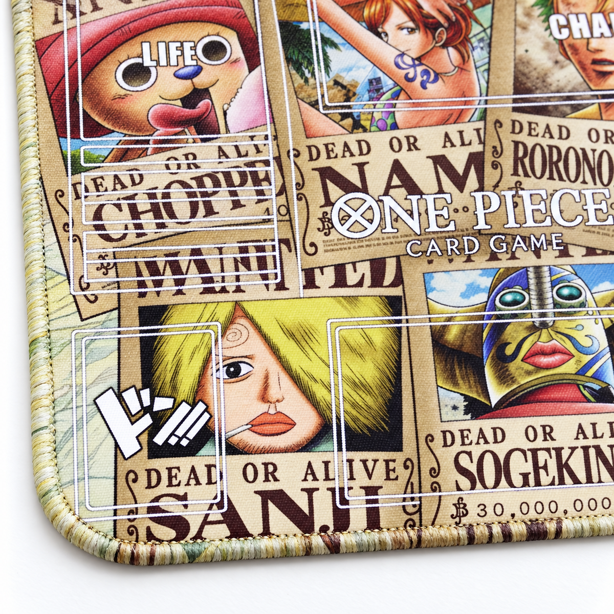 Close-up of artwork-colored stitched corner on Straw Hat Pirates Wanted Posters One Piece playmat