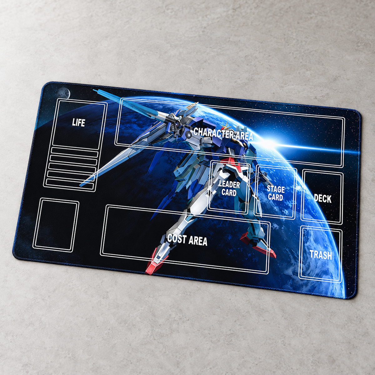 Strike Freedom Gundam 60 x 35 cm playmat — angled view, artwork-colored stitched edges